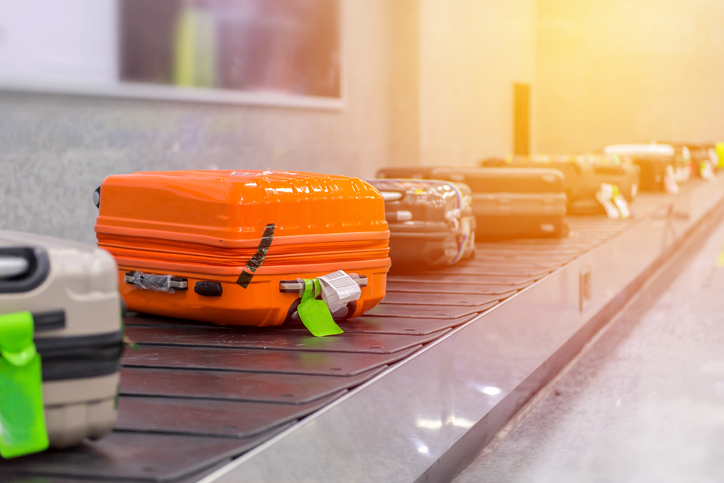 Luggage on carousel in baggage claim